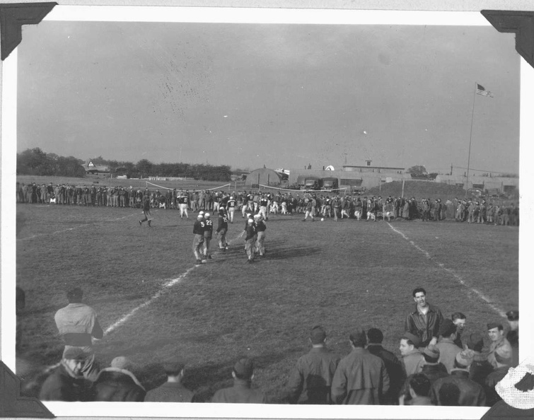 Football Game. Looking north toward Station HQ and Offices, Ops Block, and Briefing Room Annex. 546th BS dispersals are in the distance.
Source: Robert Bletscher, 2011.
Bletscher: I had sent someone to copy the records, but unfortunately they were too big to be copied on a regular scanner. The Agency Chief at the Air Force Historical Research Agency at Maxwell AFB, in Alabama, decided that they were records that should be preserved, and as a result had his department take care of them. 163.jpg