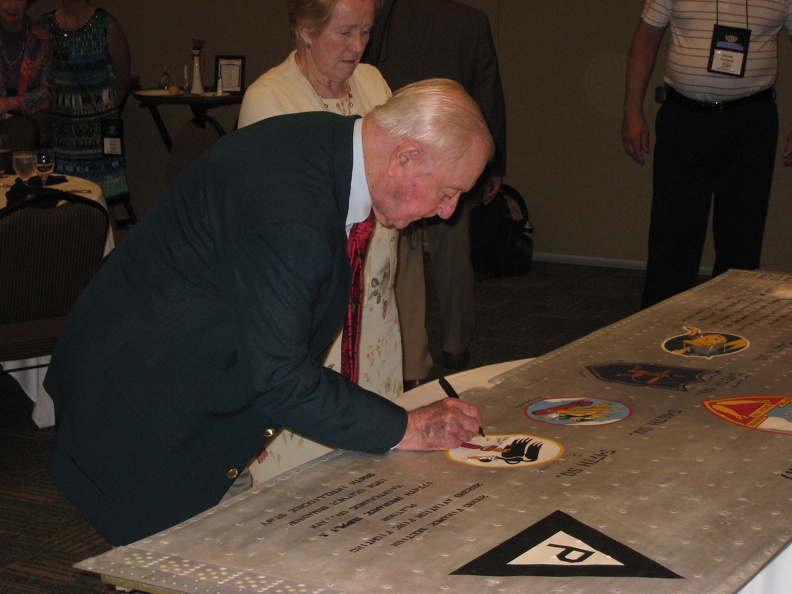 Gene Goodrick signing the wing panel.