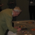 Gene Voiland signing the wing panel.