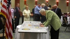 Gene Voiland signing the wing panel.