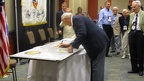 Henry Sienkiewicz signing the wing panel.