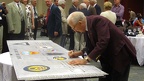 Jack Goetz signing the wing panel.