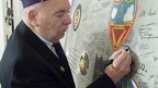 Adding his signature to the Commemorative Wing Panel