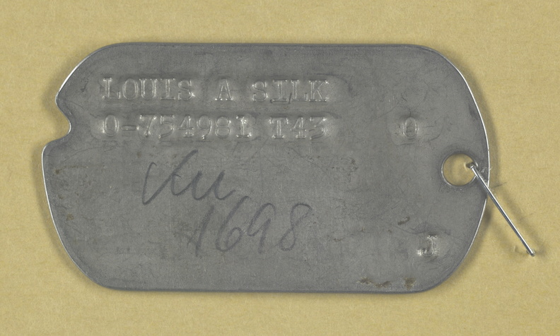 Louis Allan Silk was assigned as Bombardier on the Robert A Green Crew.
POW on 29 April 1944 while flying with James A. Bouvier as Crew Pilot. Bouvier was originally assigned as Co-Pilot on the Gerald Heim Crew.
Image located in NARA File KU-1698. Louis Allan Silk, ID Tag.jpg